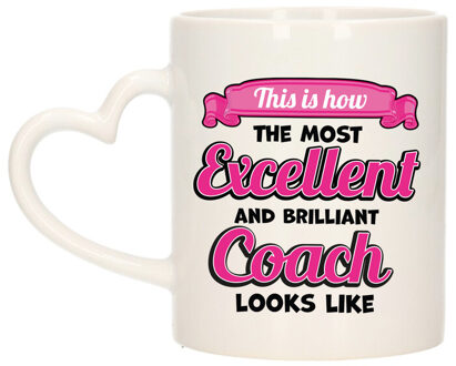 Bellatio Decorations Cadeau koffie/thee mok - excellent trainer/coach - roze - keramiek - 300 ml