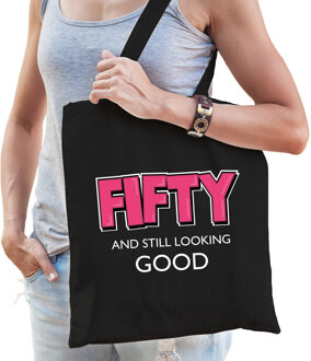 Bellatio Decorations Fifty and still looking good verjaardag cadeau tas zwart met roze letters voor dames - Verjaardag /