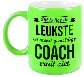 Bellatio Decorations Leukste en meest geweldige coach cadeau mok / beker neon groen 330 ml - cadeau trainer - feest mokken