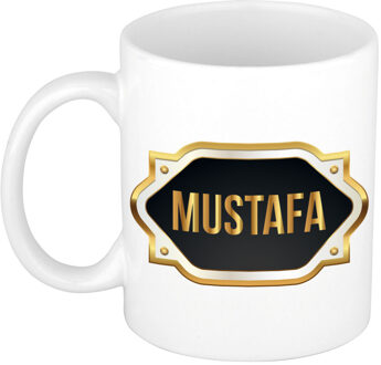 Bellatio Decorations Naam cadeau mok - heren - Mustafa - gouden embleem - 300 ml - meester - bedankje