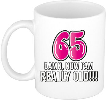Bellatio Decorations Verjaardag cadeau mok 65 jaar - nu ben ik echt oud! - roze - 300 ml - keramiek