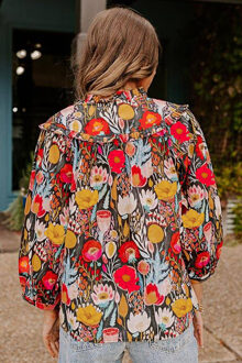 Bloemenshirt met V-hals en ruffles Zwart