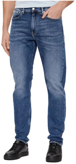 Calvin Klein Slim Jeans in Medium Denim Calvin Klein , Blue , Heren - W33 L32,W38 L32,W34,W32,W31,W29,W30 L32,W30,W29 L32,W38,W36 L32,W32 L32,W33,W34 L32,W31 L32