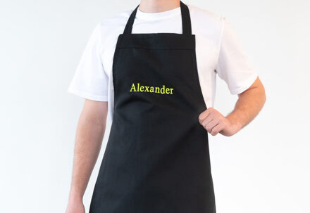 Geborduurd schort zwart