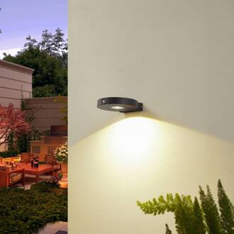 LED-zonne-wandlamp Tavon, rond, zwart, sensor
