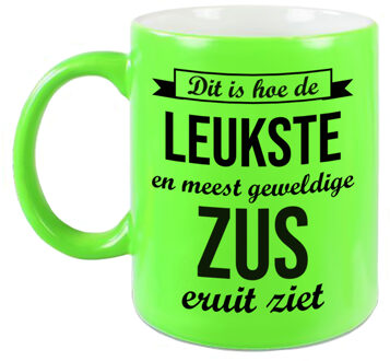 Leukste en meest geweldige zus cadeau koffiemok / theebeker neon groen 330 ml - feest mokken