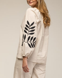 Set van broek en top met borduursel op de mouwen Beige