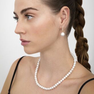 Sterling zilveren 925 oorbellen met witte parel afgewerkt in 18K geelgoud - Nolshu - One Size