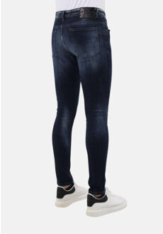 Stretch jeans slim fit met scheuren mm Blauw - 32