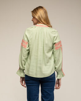 Top met zoomdetails en manchetten met ruches - maat Groen